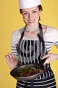 Young and attractive female chef.