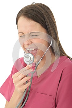 Young Attractive Female Doctor Screaming Down A Stethoscope
