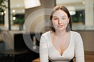 Young attractive female office worker smiling at the camera. Video conference, call, profile picture, handsome businessman