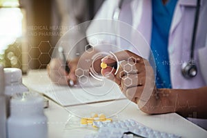 Young attractive female scientist holding pill with futuristic chemical formulas and research data.