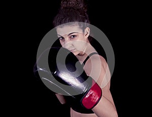 Young attractive girl with boxing gloves