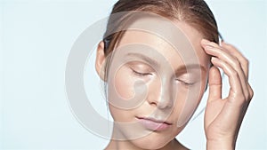 Young attractive girl gently holds a finger in the face