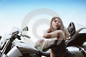 Young attractive girl and motorcycle