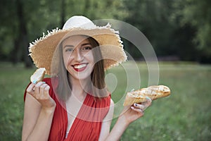 Young attractive girl on a picnic in a city park