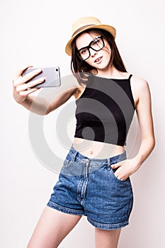 Young attractive girl taking selfie photo