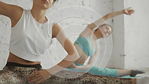 Young Attractive Girls do Yoga in Group. Healhty lifestyle concept.