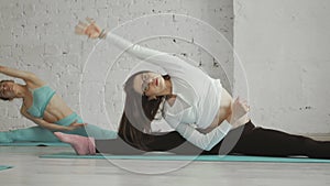 Young Attractive Girls do Yoga in Group. Healhty lifestyle concept.