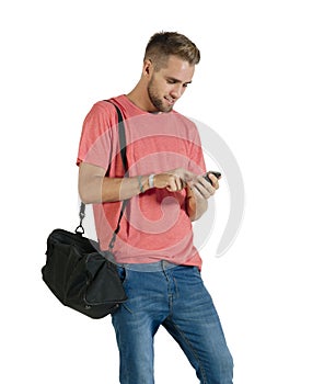 Young attractive guy using his mobile phone