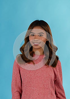 Young attractive happy asian girl in studio