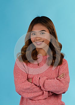 Young attractive happy asian girl in studio