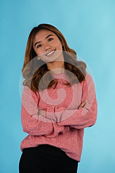 Young attractive happy asian girl in studio