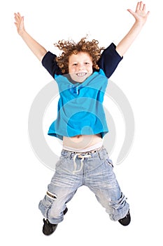 Young and attractive kid jumping high