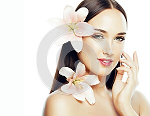 young attractive lady close up with hands on face isolated flower lily brunette spa nude makeup, beauty concept