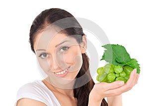Young attractive lady with green grape cluster