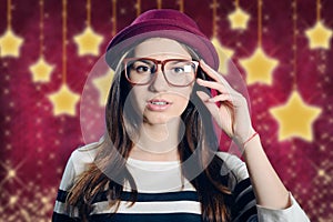Young attractive lady in hipster glasses on starry