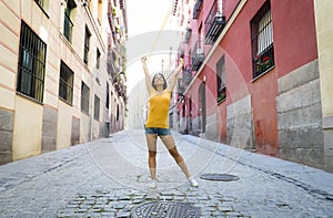 Young attractive latin woman happy and excited posing on modern urban European city