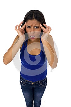 Young attractive latin woman holding her head in stress suffering headache and migraine