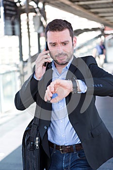 Young attractive man being late to an appointment