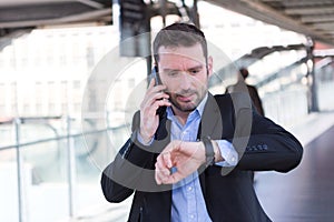 Young attractive man being late to an appointment