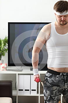 Young attractive man engaged in fitness