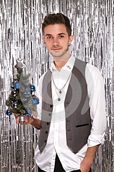Young attractive man in a festive New Year& x27;s look