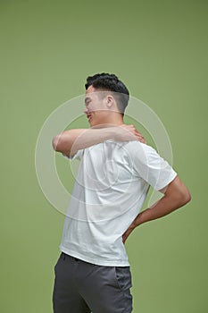 Young attractive man having shoulder pain