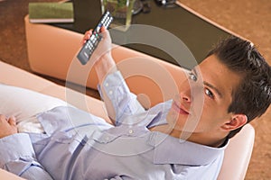 Young attractive man sitting on couch