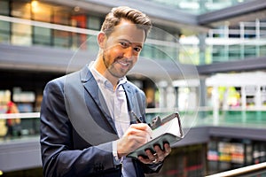 Young attractive man taking a new appointment