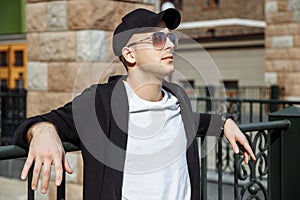 Young attractive man in urban background