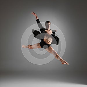 The young attractive modern ballet dancer jumping