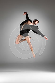 The young attractive modern ballet dancer jumping