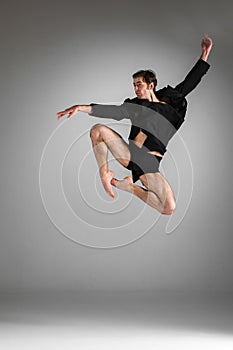 The young attractive modern ballet dancer jumping