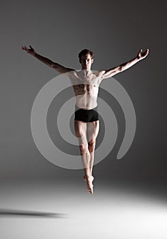 The young attractive modern ballet dancer jumping
