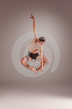 The young attractive modern ballet dancer jumping