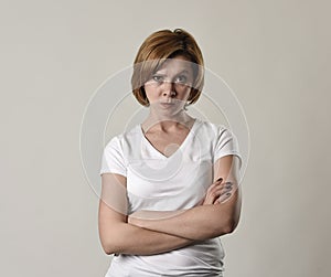 Young attractive and moody woman posing alone angry and upset in bad mood and rage face