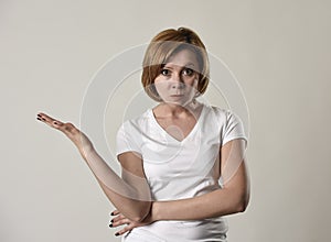 Young attractive and moody woman posing alone angry and upset in bad mood and rage face