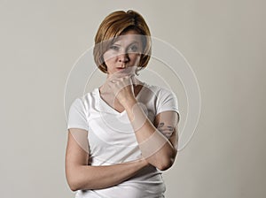 Young attractive and moody woman posing alone angry and upset in bad mood and rage face