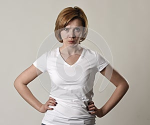 Young attractive and moody woman posing alone angry and upset in bad mood and rage face