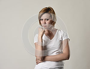 Young attractive and moody woman posing alone angry and upset in bad mood and rage face