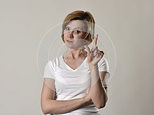 Young attractive and moody woman posing alone angry and upset in bad mood and rage face