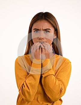 Young attractive nervous scared asian girl in studio