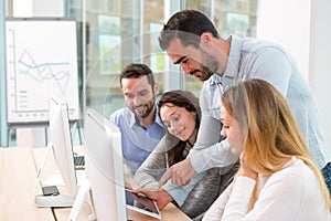 Young attractive people taking a training course with formator