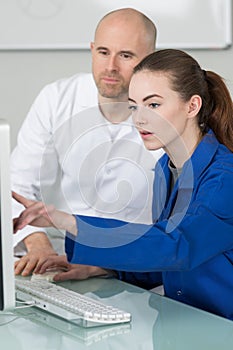 Young attractive people taking training course with formator