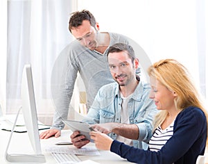 Young attractive people taking a training course