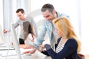 Young attractive people taking a training course