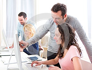 Young attractive people taking a training course