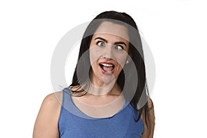 Young attractive and playful woman sticking out tongue and crossing eyes looking crazy