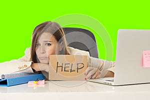 Young attractive sad and desperate businesswoman suffering stress at office laptop computer desk green croma key background