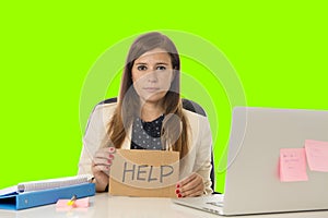 Young attractive sad and desperate businesswoman suffering stress at office laptop computer desk green croma key background