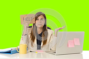 Young attractive sad and desperate businesswoman suffering stress at office laptop computer desk green croma key background